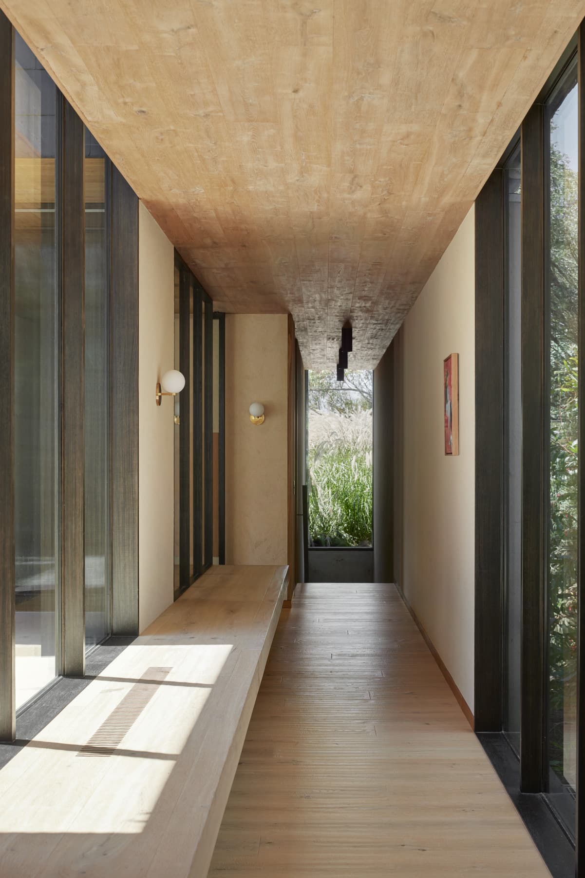 Timber hallway with bench and warm natural light